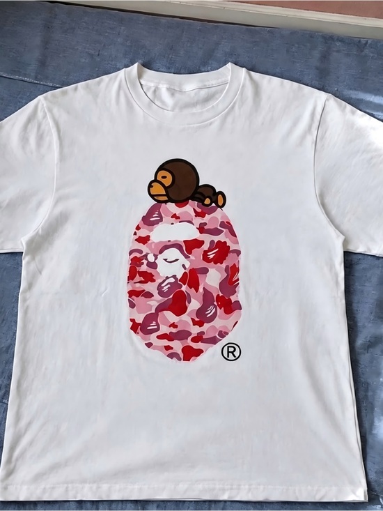 Jan
A Tops - Baby Milo Pink Camo Ape Head White Streetwear Graphic Womens Mens T-shirt Unisex